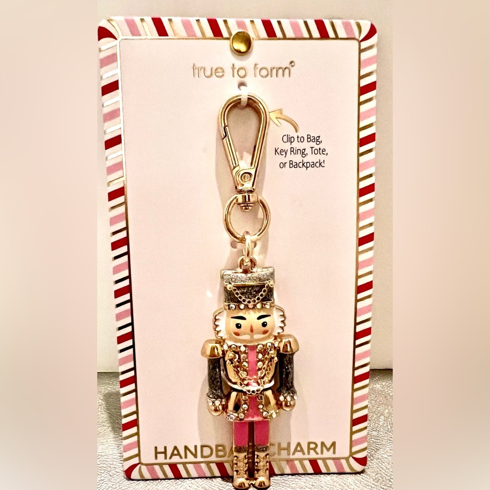 New Nutcracker Keychain Holder. True to Form. Pink/Blk enamel. Gold tone.
